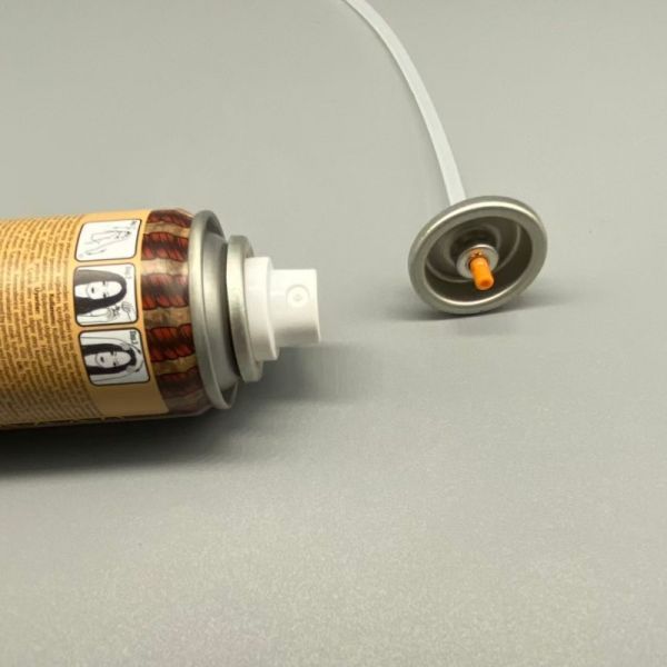 Dry shampoo aerosol spray valve close-up view showing detailed nozzle design and construction