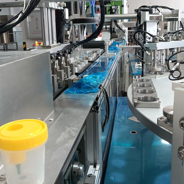 Non-standard automated urine cup assembly machine, labelling and packaging