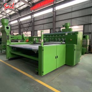 Winding rewinding and cutting machine for nonwoven fabric