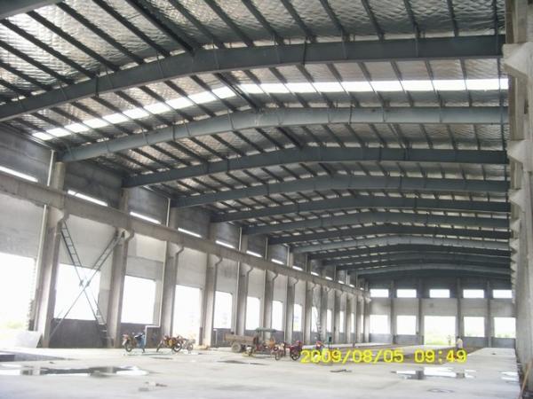 Quality steel structure frame workshop warehouse and sandwich panel wall roof and roller shutter door for sale