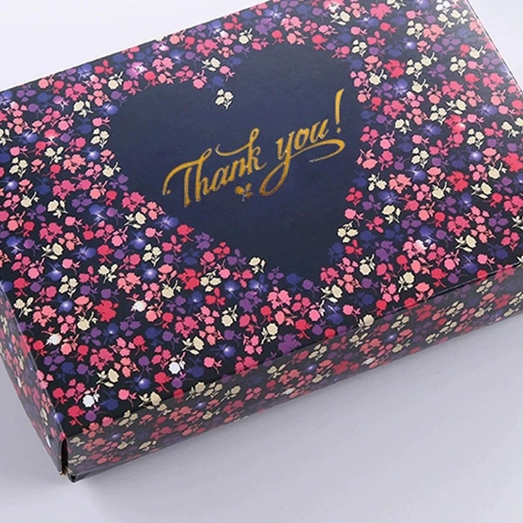 Navy blue floral pattern paper box with gold foil thank you text for boutique retail packaging