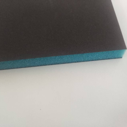 Sponge sand block in use on metal surface
