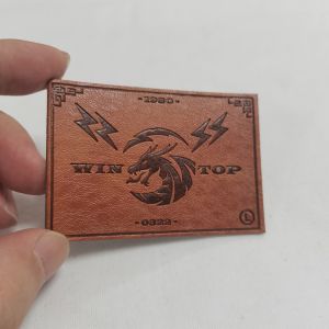 China New Design Custom Embossed Logo Faux Leather Labels Stitching Custom Embossed Leather Patches for Garments Leather Badges on sale