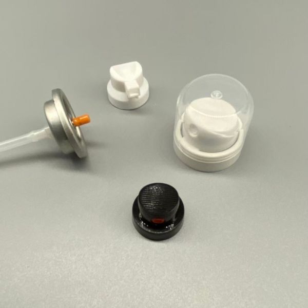 Aerosol valve assembly components for dry shampoo application showing internal mechanism