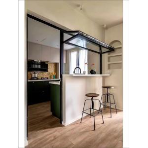 Haven Library Focused Folding Window Design Minimizing Glare on Book Pages While