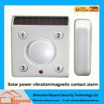 Solar power vibration magnetic contact alarm with rechargeable Li-Ion backup